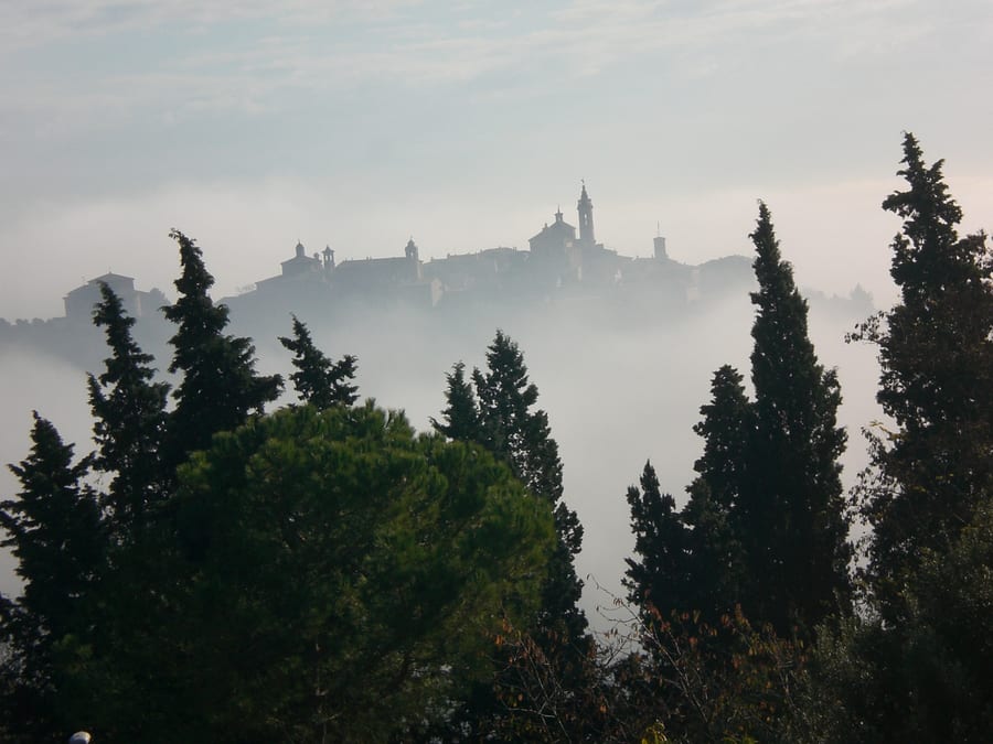 Corinaldo in the fog — The village rising out of the Marche valley floor