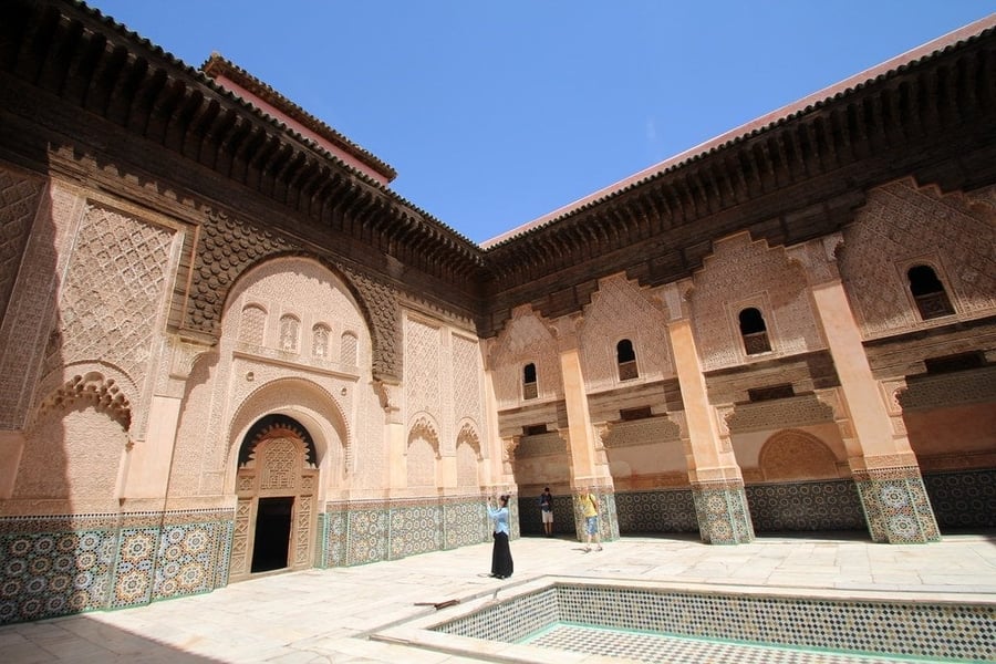 Ben Youssef Madrasa — A courtyard of carved stucco that was once the largest Quranic school in the Maghreb