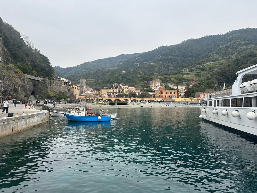 The old village's little harbour — Boats among houses dropping straight to the sea