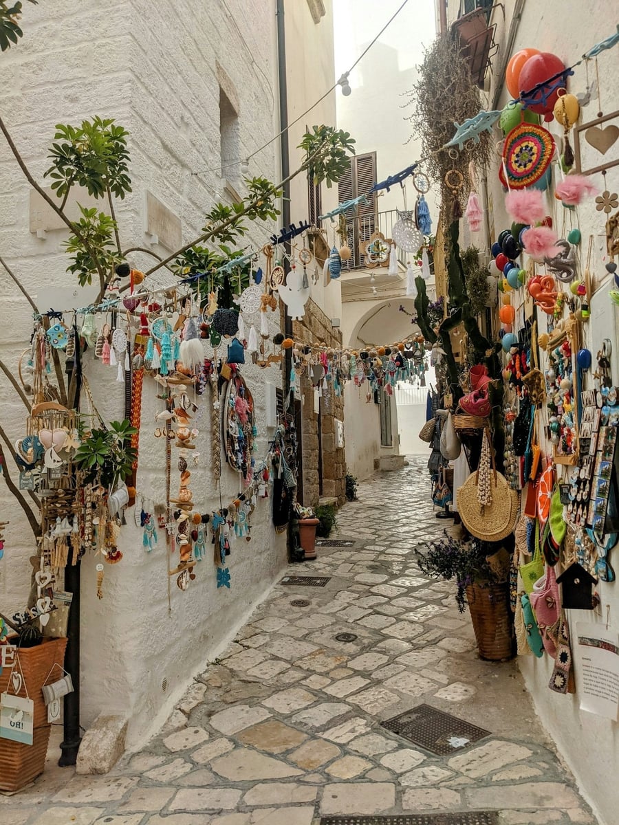 The craftsmen's lanes — Handmade jewellery hung along the whitewashed walls