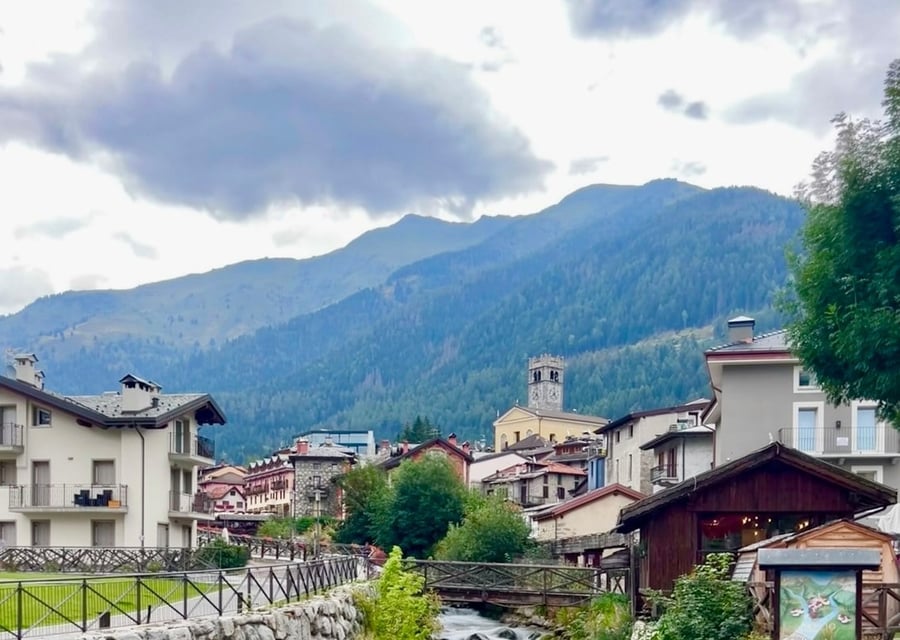 The stream through the heart of the village — Clear mountain water rushing between the houses of Ponte di Legno