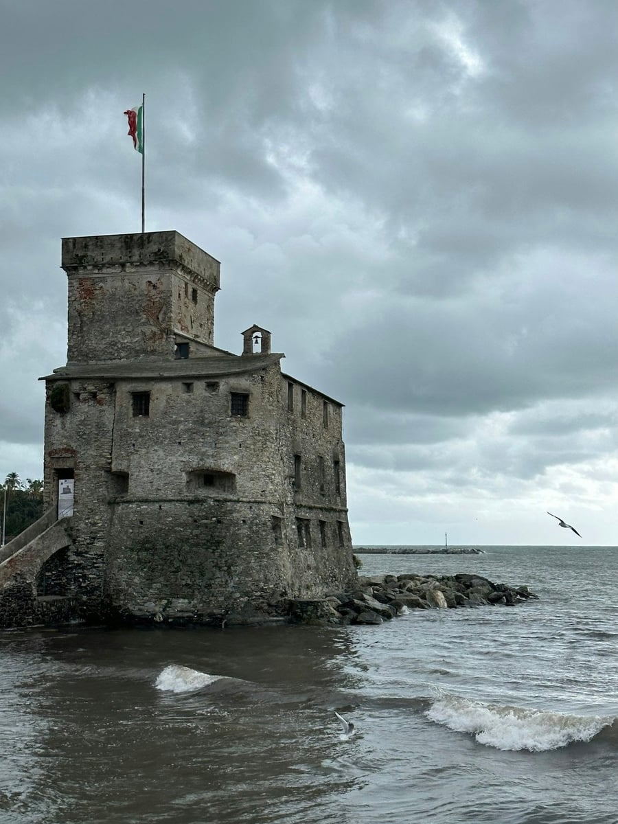 The castle on the sea — The fortress on the rock, under a stormy sky
