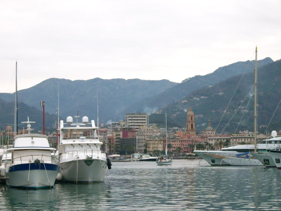 The port of Rapallo — Sailboats and fishing boats at the foot of the old town