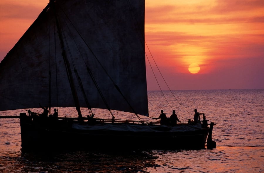 Dhow at sunset — Triangular sails that have crossed the Indian Ocean for over a thousand years